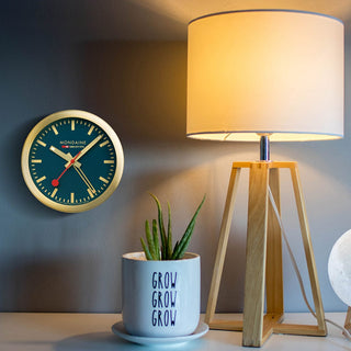Table clock, 125mm, Deepest Blue Table and Alarm Clock, A997.MCAL.46SBG, mood image of the clock on the wall